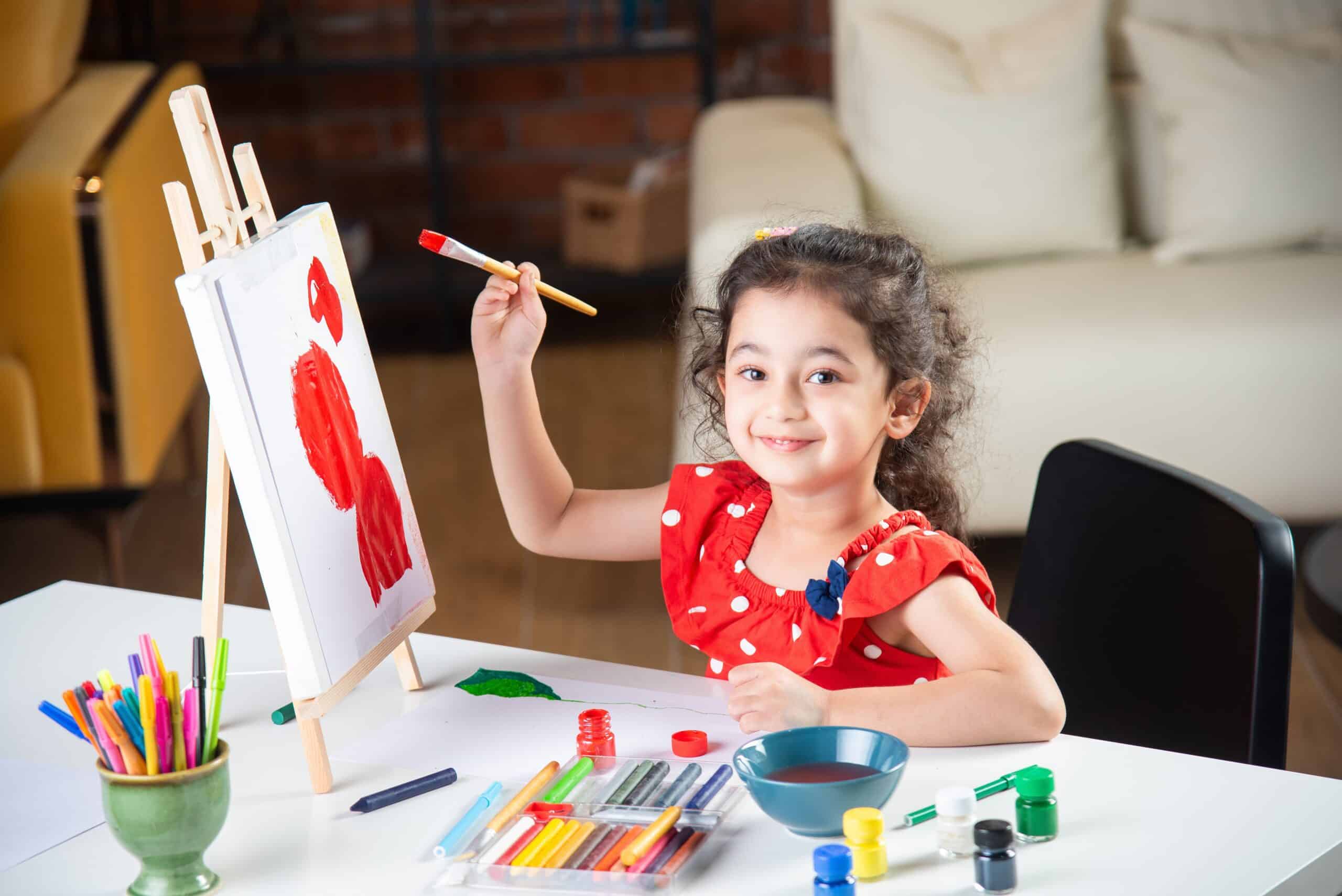 Student painting in a classroom